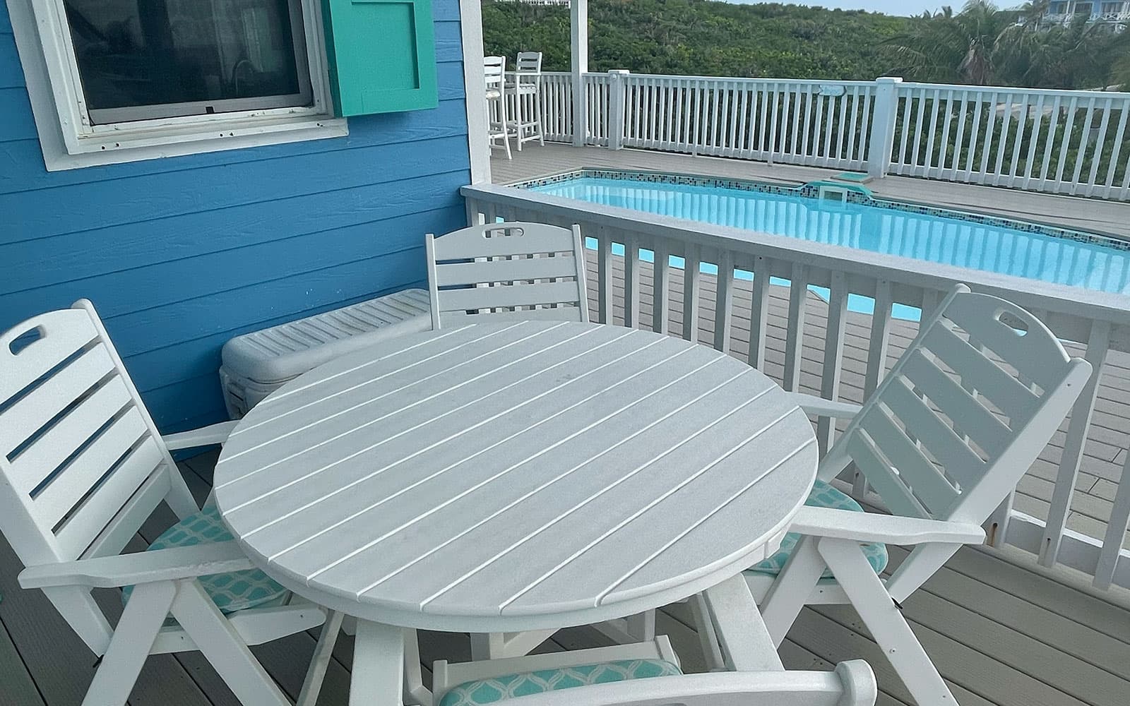 Covered deck dining table with island views