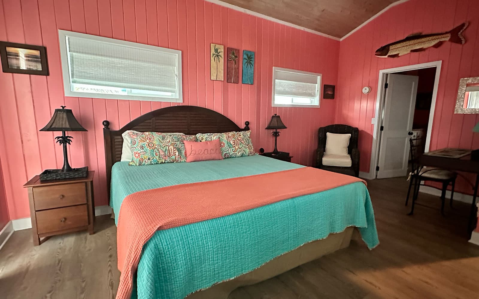 Master bedroom with a king bed and bright island light