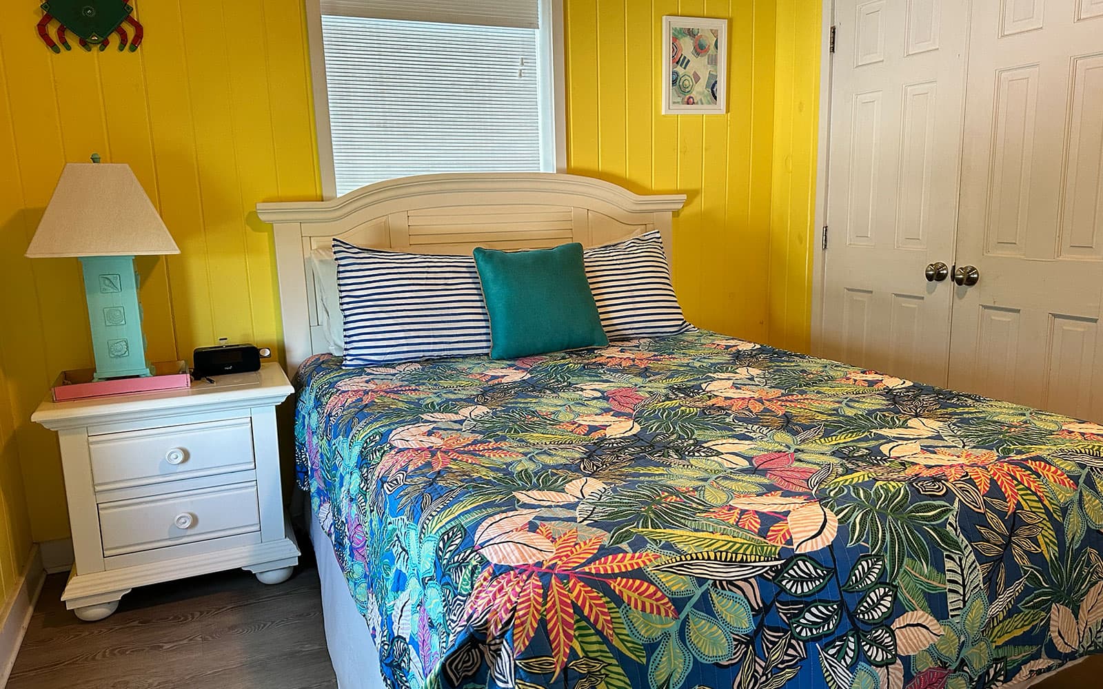 Queen bed alongside the room's full closet